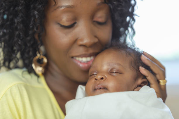 Loving mother gently holding her newborn baby - representing the beautiful journey of fertility and motherhood